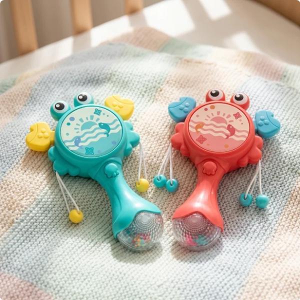 Baby Rassel Krabbe - Lernspielzeug mit Glitzergriff