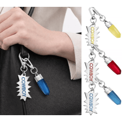 Cooles Calvin Klein Charm-Set Downtown Edelstahl-Anhänger mit kontrastfarbigen Harz und COWBOY-Schriftzug Taschen-Accessoires 7x1,3cm Gelb