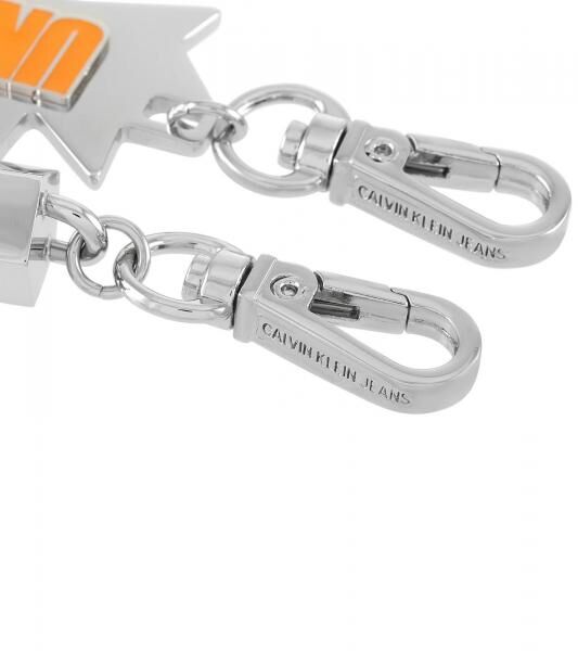 Urbanes Calvin Klein Charm-Set Downtown Edelstahl-Anhänger mit kontrastfarbigen Harz und UNITE-Schriftzug Taschen-Accessoires 7x1,3cm KJJC